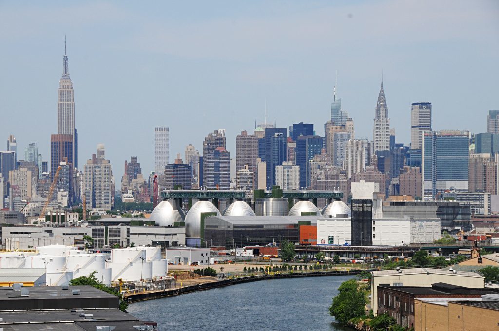 Newtown Creek waterway bordered by industrial buildings.